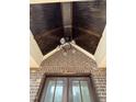 View of the front porch ceiling with wood panels and modern lighting fixture at 3920 Cedar Knolls Drive Dr # 18, Youngsville, NC 27596