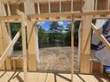 Framed opening with a view of a lake and trees during construction at 42 Ponchartrain St, Fuquay Varina, NC 27526