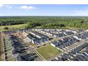 Expansive aerial view of the community, highlighting the layout and surrounding trees at 43 Pansy Park # 233, Clayton, NC 27520