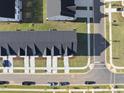 Overhead view of townhomes showcasing the rooftops, driveways, and landscaping at 43 Pansy Park # 233, Clayton, NC 27520