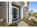Close-up of a townhome's front entrance, showcasing the door and entryway at 43 Pansy Park # 233, Clayton, NC 27520