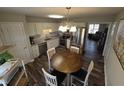 Spacious kitchen with stainless steel appliances, breakfast nook, and wood flooring, ideal for Gathering gatherings at 46 Grain Ln, Henderson, NC 27537