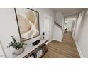 Inviting hallway featuring stylish decor and an open view of the staircase at 520 Folk Song Way, Wendell, NC 27591