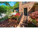 Inviting walkway leads to the front door surrounded by lush landscaping at 103 Windhover Dr, Chapel Hill, NC 27514