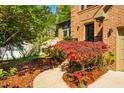 Inviting walkway leads to the front door surrounded by lush landscaping at 103 Windhover Dr, Chapel Hill, NC 27514