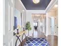 Stunning foyer with hardwood floors, elegant console table, and stylish decor at 1112 Addington Lake Ln, Knightdale, NC 27545
