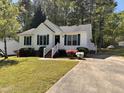 Inviting home with colorful landscaping and a paved driveway at 1204 Amberstone Dr, Knightdale, NC 27545