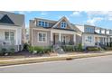 Charming home featuring a cozy front porch and stone accents, set in a welcoming neighborhood at 149 Logbridge Rd, Chapel Hill, NC 27516