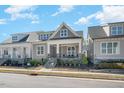 Charming home featuring a cozy front porch and stone accents, set in a welcoming neighborhood at 149 Logbridge Rd, Chapel Hill, NC 27516