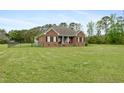 Charming brick home with a covered front porch and a spacious front yard at 1500 Antioch Rd, Rocky Mount, NC 27801