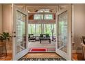 Sun-drenched room with floor to ceiling windows offering serene nature views of the surrounding forest at 18 Green Ridge Ln, Pittsboro, NC 27312