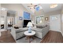 Bright living room featuring vaulted ceilings, hardwood floors and comfortable seating area at 20 Izuba Day Dr, Timberlake, NC 27583