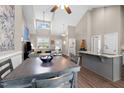 Open concept living and dining area with vaulted ceilings and updated kitchen with stainless steel appliances at 20 Izuba Day Dr, Timberlake, NC 27583