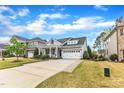 Attractive home showcases a long driveway and beautiful lawn at 2321 Swansea Ln, Apex, NC 27502