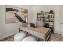 Comfortable home office with modern desk, bookshelf, stylish decor, and plush rug with ample space at 25 Granite Falls Way, Youngsville, NC 27596