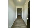 Inviting entryway with hard wood flooring and neutral paint, leading into the home's interior at 288 Olivia Crossing Ct # 10, Four Oaks, NC 27524