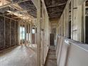 Open-concept home under construction with exposed framing, wiring, and future wall placements ready for customization at 2895 Bakers Chapel Rd, Smithfield, NC 27577