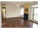 Inviting living room with hardwood floors, fireplace, ceiling fan, and natural light at 3015 Winston Dr # 111, Burlington, NC 27215