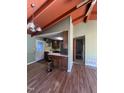 Open kitchen space boasting wood cabinets, and modern lighting fixtures at 327 Holland Dr Rd, Smithfield, NC 27577