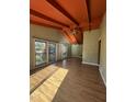 Inviting living room featuring high ceilings, exposed beams, and lots of natural light at 327 Holland Dr Rd, Smithfield, NC 27577