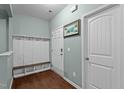 Welcoming foyer with convenient coat rack and mudroom bench seating at 4523 Tarkiln Pl, Wake Forest, NC 27587