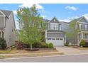 Well-maintained home with a two-car garage, beautiful landscaping, and a welcoming front yard at 463 Old Piedmont Cir, Chapel Hill, NC 27516