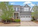 Charming two-story home with a well-manicured lawn, a two-car garage, and inviting curb appeal at 463 Old Piedmont Cir, Chapel Hill, NC 27516