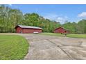 Two outbuildings with ample space and potential, perfect for various needs and hobbies at 5069 Cokesbury Rd, Fuquay Varina, NC 27526