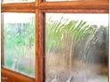 Close up of glass window, offering privacy with textured and slightly distorted view at 518 Morgan Creek Rd, Chapel Hill, NC 27517