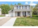 Beautiful home with a well-manicured lawn and an attached single car garage at 622 Twain Town Dr, Knightdale, NC 27545
