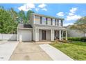 Inviting two-story home with a classic design, attached garage, and a well-kept front yard at 622 Twain Town Dr, Knightdale, NC 27545
