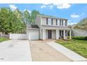 Attractive two-story home with a well-manicured lawn and an attached single car garage at 622 Twain Town Dr, Knightdale, NC 27545