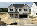 Two story home with a front yard and two car garage in a development at 705 Compeer Way # 31, Rolesville, NC 27571