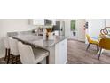 Well-equipped kitchen with granite countertops, stainless steel appliances, and a breakfast bar at 120 Holmes Corner Dr, Smithfield, NC 27577