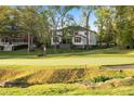 Back exterior view overlooking the golf course at 1213 Rocky Point Ln, Durham, NC 27712
