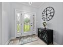 Inviting foyer with patterned glass front door, side-lights, and stylish decor at 1325 George Bason Rd, Graham, NC 27253