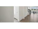 Welcoming entryway showcasing hardwood floors and staircase leading to the upper level at 135 Carlton Ln, Franklinton, NC 27525
