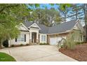 Well-maintained home with a long driveway and attached garage at 1537 Heritage Club Ave, Wake Forest, NC 27587