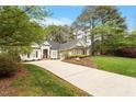 Charming home with a lush front yard and a long driveway at 1537 Heritage Club Ave, Wake Forest, NC 27587