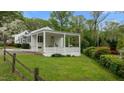 This home offers a lovely backyard view with a covered deck, perfect for relaxing or entertaining guests outdoors at 1631 Sunset Ave, Henderson, NC 27536