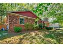 Exterior view of brick home showing roof and side yard at 201 Dunhagan Pl, Cary, NC 27511