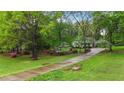 Beautiful property nestled among mature trees, offering privacy and a serene setting at 2024 Country Trails Dr, Clayton, NC 27520
