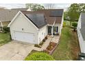 Attractive home showcasing solar panels, a well-maintained yard, and a cozy entrance at 2124 Castle Pines Dr, Raleigh, NC 27604