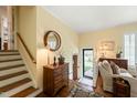 Bright foyer showcasing hardwood floors, staircase, and decorative furnishings at 2415 Alpine Rd, Durham, NC 27707