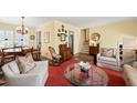 Inviting living room with hardwood floors, a comfortable seating arrangement, and stylish decor at 2415 Alpine Rd, Durham, NC 27707