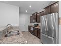Kitchen featuring stainless steel appliances, granite countertops and tile flooring at 2705 Evanston Ave, Durham, NC 27703