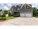 Beautiful home with an attached garage, well-manicured lawn, and a long driveway for ample parking at 2905 Pluton Pl, Rolesville, NC 27571