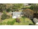 Aerial view of the house and backyard including a nice patio area at 310 Edward Ln, Louisburg, NC 27549