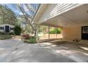 Spacious carport with adjacent storage building in a serene backyard setting at 310 Edward Ln, Louisburg, NC 27549