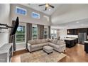 Bright living room with vaulted ceilings, ample natural light, and an open-concept design to the kitchen at 318 Acorn Hollow Pl, Durham, NC 27703